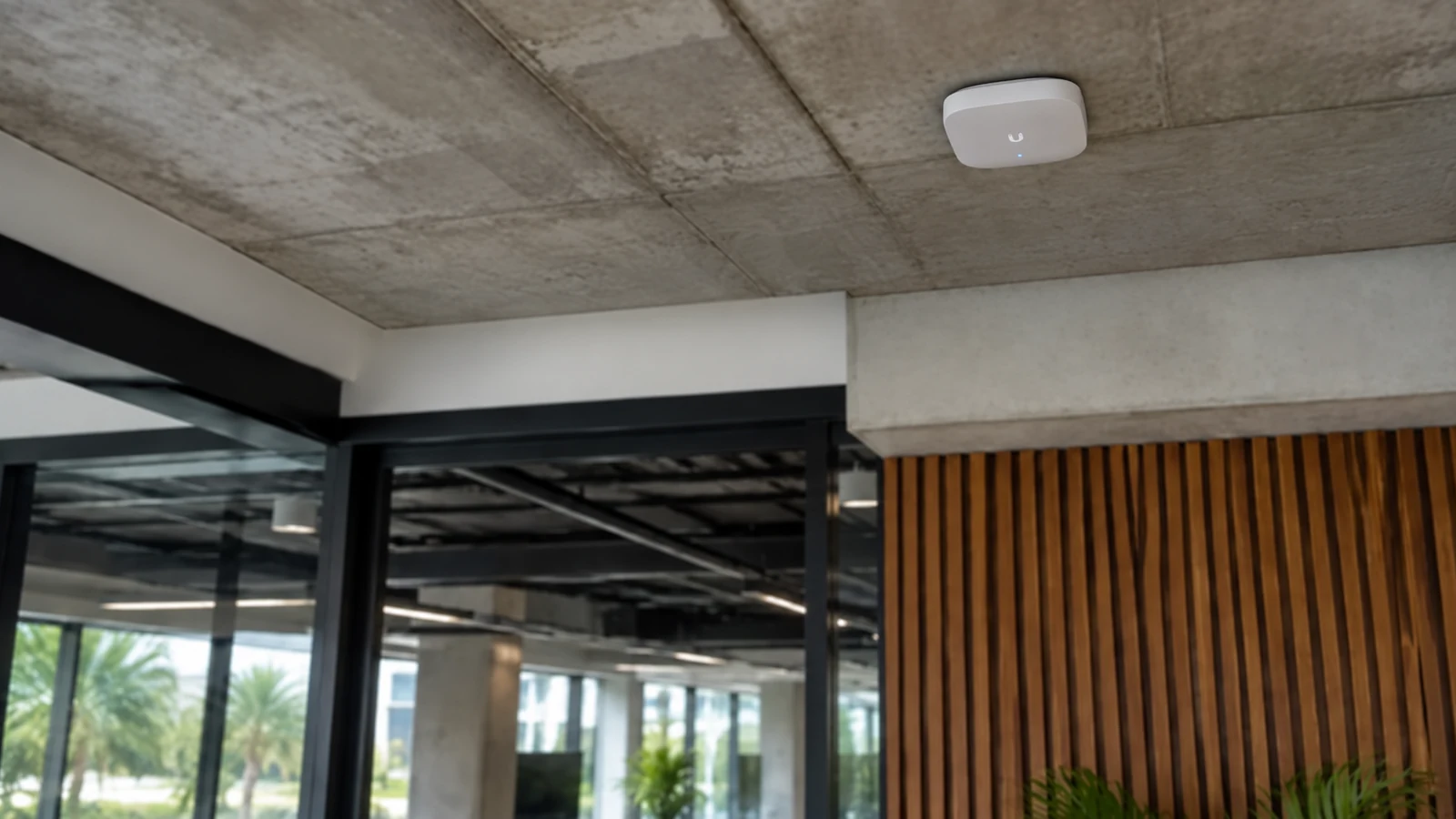 Commercial wireless access point installed cleanly on a finished office ceiling.